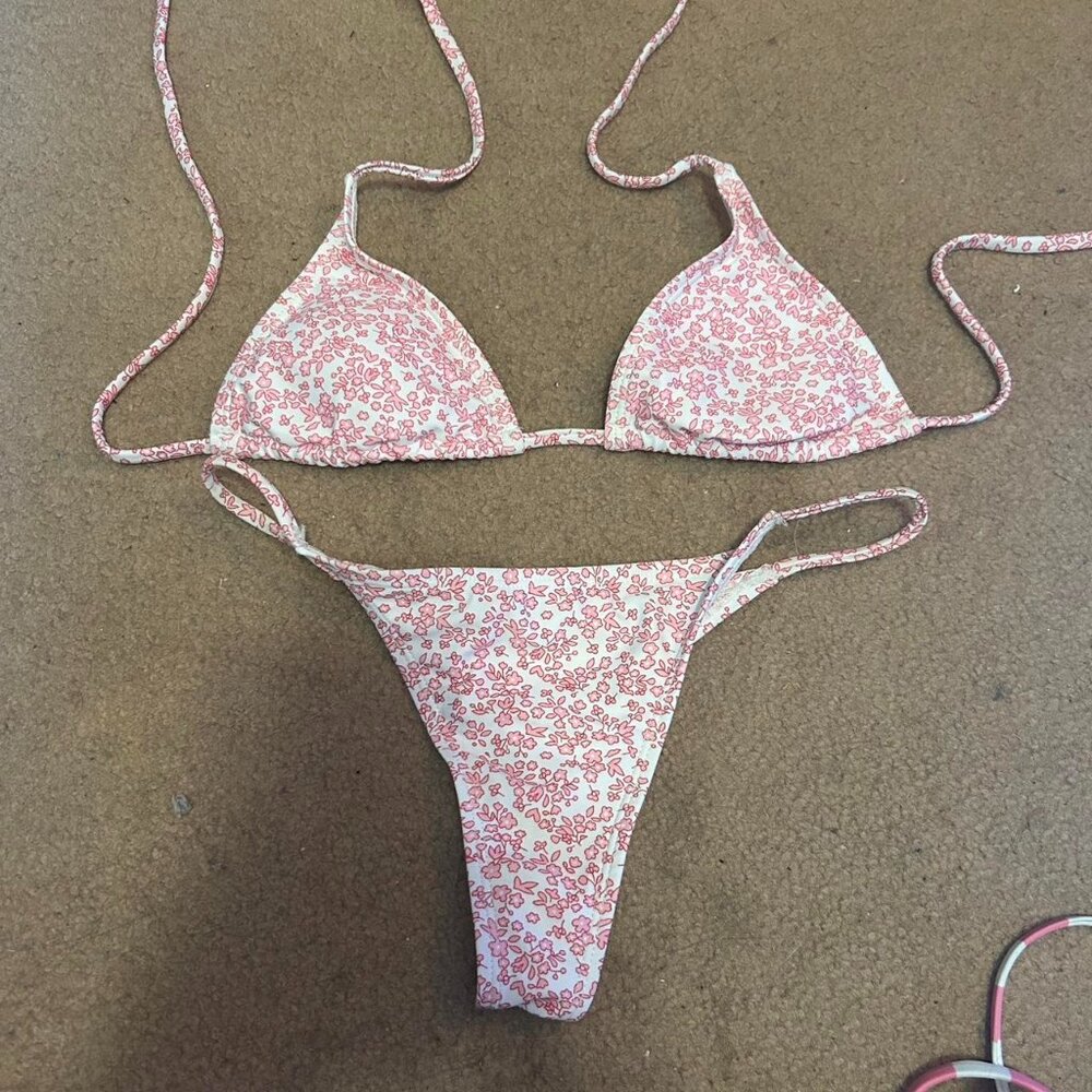 Pink floral thong bikini set with matching skirt